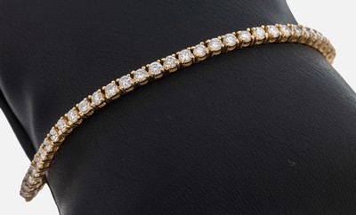 14 kt Gold Brillant-Linienarmband, GG 585/000, 60 Brillanten zus. ca. 4.0 ct feines Weiß-l.get.Weiß/vs-si, L. ca. 18.5 cm, Kastenschloss mit 2 ...