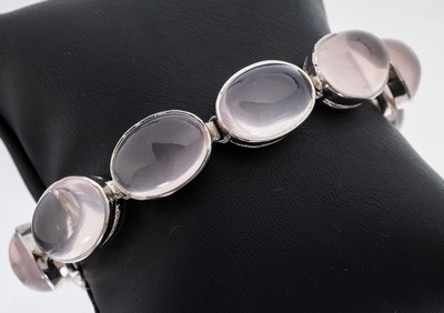 Rosenquarz-Armband, 925er Silber, schlichtes Design, 10 ovale Rosenquarz- Cabochons zus. ca. 12.0 ct, L. ca. 20 cm, Kastenschloss mit 2 ...