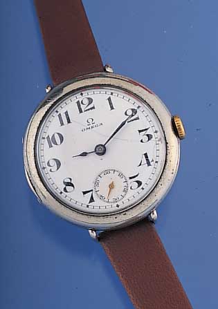 OMEGA Herrenarmbanduhr, Ref.-Nr. 5451122, Schweiz um 1915, Nickelrundgeh., D. 35 mm, Scharnierboden, Glasrand gedr., Orig.-Emailbl.sign., ...
