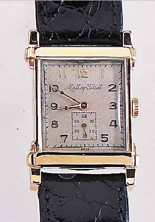 MATHEY TISSOT HERRENARMBANDUHR, REF.-NR. 491843, SCHWEIZ/USA UM 1949, GG 585/000, AUF- WEND. RECT.-FORM M. BET. BANDANST., BODEN GE- DR., ...