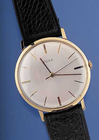 DOXA HERRENARMBANDUHR, REF.-NR. 10365/13, SCHWEIZ UM 1964, GG 585/000, GLASRAND GEDR., VERS. BLATT M. ERHABENEN GOLDENEN ...