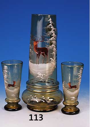 Kanne mit sechs Gl„sern, deutsch, um 1890, grnes Glas mit Emailmalerei, Winterlandschaf-ten mit Hirsch bzw. Rehen, H. ca. 32,5 bzw. 16,5 cm