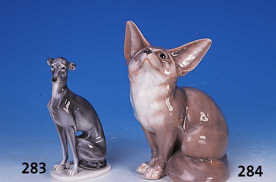 Porzellanskulptur, Steingut, 20er Jahre, Hund, bemalt, H. ca. 19 cm