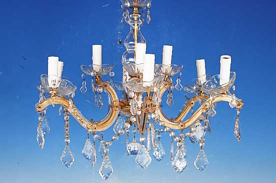 Deckenleuchter, 50er Jahre, glasummantelte Metallmonturen, facett. Glasbehang, H. ca. 46 cm, D. ca. 60 cm, Elektr. nicht geprft, neun ...