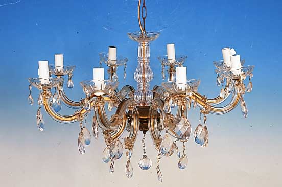 Deckenleuchter, 50er Jahre, glasummantelte Metallmonturen, facett. Glasbehang, 8 Brenn- stellen, Elektr. nicht geprft, H. ca. 37 cm, D. ca. 60 cm