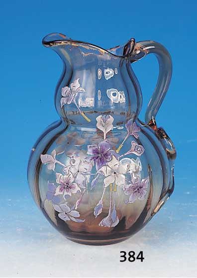Henkelkrug, sign. Cristallerie d'Emile Gallé, Nancy, um 1885, bräunliches Glas optisch ge-blasen, bunte florale Emailmalerei, am Ansatz des ...