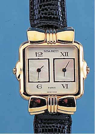 NINA RICCI DAMENARMBANDUHR, DESIGNERMODEL, REF.-NR. W974, SCHWEIZ/FRANKR. UM 1990, MES- SING HARTVERG., BODEN AUFGEDR., LEDERBAND, ORIG. ...
