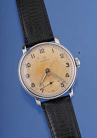 OMEGA Herrenarmbanduhr, Ref.-Nr. 9833793, Schweiz um 1942, Edelst., Boden u. Glasrand gedr., Orig.-Blatt farbl. get., Lederband spä-ter, 15 ...