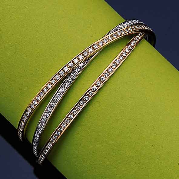 3 TEIL. ARMREIF M. BRILLANTEN, GG/WG/RG 750/000, CA. 264 BRILLANTEN ZUS. CA. 7.92 CT FEINES WEIß/VVS-VS, TOTAL CA. 54.2 G