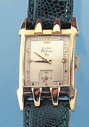 ELGIN HERRENARMBANDUHR MODELL DELUXE, REF.- NR. 316184/5526, USA UM 1952, GG-FILLED, BODENGEDR., IN SICH GEW., 2-FARB. VERS. ORIG.-BLATTKL. SEK. ...