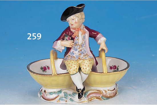 Salzgefäß, Meissen, um 1850, Porzellan, mit vollplastischer Knabenfigur, bunt bemalt, Hen-kel restauriert, H. ca. 14 cm