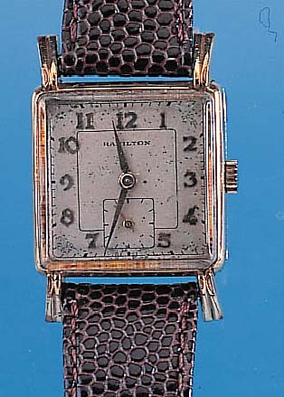 HAMILTON Herrenarmbanduhr, Ref.-Nr. S703728,USA um 1952, GG-filled-Geh., Carree-Arronde- Form, gespr. Bandanst., Boden gedr., Konkav- gl., vers. ...
