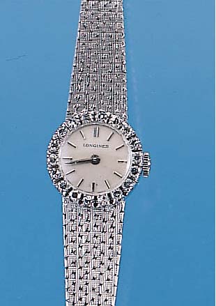 LONGINES Damenarmbanduhr, neutr. WG 750/000-Geh. incl. WG-Band, Lünette m. 8/8 Diamanten zus. ca. 0,54 ct feines Weiß, Boden gedr., vers. ...