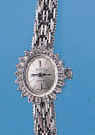 ZENITH DAMENGOLDBANDUHR, NEUTR. WG 750/000- OVAL-GEH. INCL. WG-BAND RHOD., LüNETTE M. 20 BRILLANTEN ZUS. CA. 0,3 CT L. GET. WEIß, BO- DEN GEDR., ...