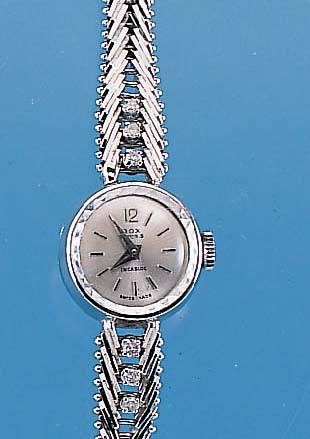 ROX Damengoldbanduhr, GG 750/000-Geh. rhod. incl. Gliederband, zu den Bandanst. je 3 8/8 Diamanten zus. ca. 0,2 ct l. get. Weiß, Boden gedr., ...