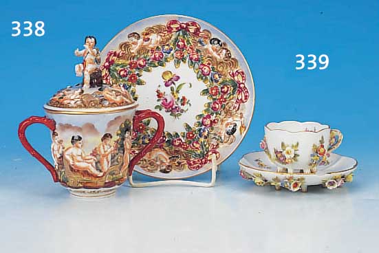 Mokkatasse mit Untertasse, Meissen, um 1900, Porzellan, 1. Wahl, reich appliziert mit bunt bemalten Blüten, diese altersbedingt leicht ...