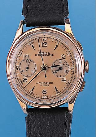 OSKA ARMBANDCHRONOGRAPH, REF.-NR. 1013, SCHWEIZ UM 1948, RG 750/000, BODEN U. GLASRANDGEDR., METALLCUVETTE ZUR ARMIERUNG, VERS. BLATT FARBL. ...