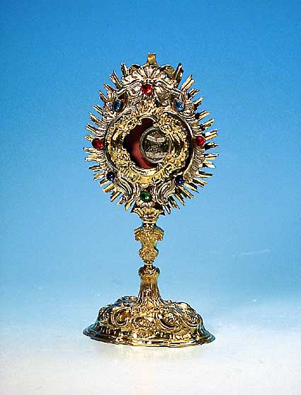 Monstranz mit Reliquie, wohl Österr., um 1900, Metall vergoldet, mit bunten Glasbesatz, Barockstil, innen mit Reliquie, H. ca. 30 cm, Bekrönung ...