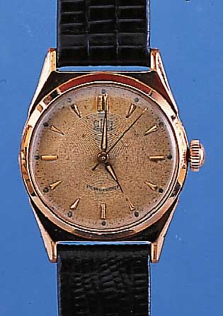 GUB HERRENARMBANDUHR, REF.-NR. 057460, DEUTSCHLAND UM 1957, METALL ROTVERG., EDELST.-BODEN GESCHR., GUILL. U. VERS. BL. FARBL. GET.16 ST., ...