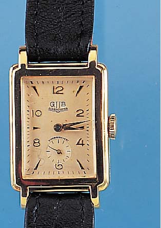 GUB HERRENARMBANDUHR, REF.-NR. 80901, DEUTSCHL. UM 1953, METALL NACHVERG., EDELST.- BOD. AUFGEDR., IN SICH L. GEWöLBT, RECTANG.- FORM, VERS. ...