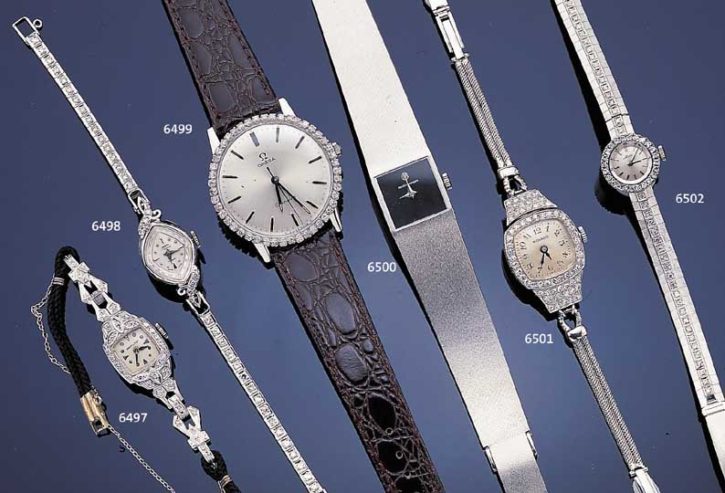 OMEGA HERRENARMBANDUHR GENEVE, NEUTR. WG 750/000-GEH. RODH., BODEN GEDR., LüNETTE AUF- WENDIG M. 8/8 DIAMANTBES. ZUS. CA. 0,65 CT, VERS. ...