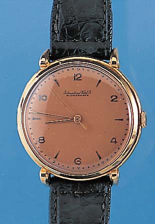 IWC Herrenarmbanduhr, Schweiz um 1951, GG 750/000, D. ca. 36 mm, kupferfarb. Blatt, Boden u. Glasr. gedr., Kal. 89, Handaufzug, Werk-Nr. ...