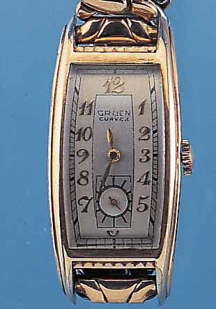 GRUEN HERRENARMBANDUHR CURVEX, REF.-NR. 501-296, SCHWEIZ/USA UM 1938, GG-FILLED, BODENEDELST., GEZ. TONNENF., IN SICH GEW., M. CA. 46 X 21 MM, ...