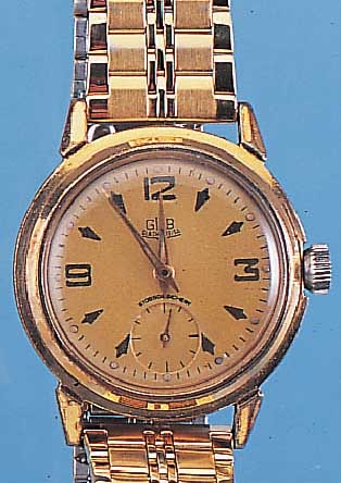 GLASHÜTTE HERRENARMBANDUHR, REF.-NR. 57935, DEUTSCHLAND UM 1954, METALL VERG., BER., EDEL-ST.-BODEN GESCHR., ORIG.-BLATT ALTERSBED. FARBL. ...