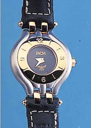MCM DAMENARMBANDUHR, STAHL Z. T. VERGOLDET U. MATTIERT, HIGH-TECH-QUARTZWERK, ETA 980 003, INCL. ORIG. LEDERBD. M. ORIG. DORNSCHL., BAT. ...