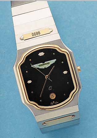 ASTON MARTIN HERRENARMBANDUHR QUARTZ, REF.- NR. 83515, SCHWEIZ UM 1988, EDELST., FL. AUS- FüHRUNG, MINERALFLACHGL., ZENTRALSEK., DATUM, ...