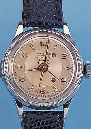 SHEFFIELD ARMBANDWECKER TRIWERA, SCHWEIZ UM 1949, METALL VERCHR., STIFTENANKERRUNDWERK, GEH. U. WECKWERK GETR. FEDERHäUSER, üBER EINE KRONE ...