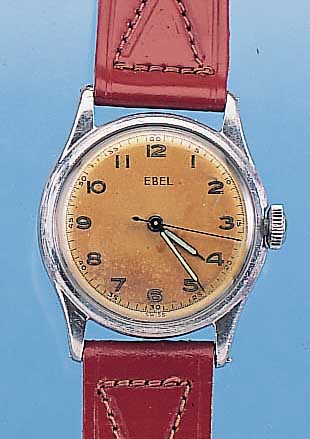 EBEL HERRENARMBANDUHR, REF.-NR. 5506, SCHWEIZ UM 1954, EDELST., BODEN GESCHR., ORIG.-BLATT FARBL. GET., 17 ST., HANDAUFZUG, KAL. 102, ...
