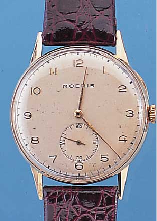 MOERIS HERRENARMBANDUHR, REF.-NR. 3116462, SCHWEIZ UM 1948, GG 750/000, GLASR. GEDR., VERS. ORIG.-BLATT L. FL., GROSSES RUNDANKERW.,13-LINIG, 16 ...