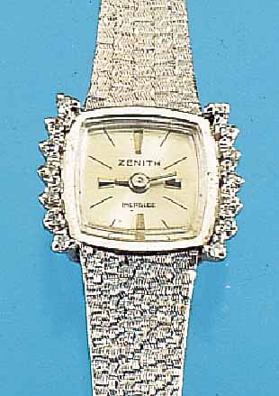 ZENITH DAMENGOLDBANDUHR, SCHWEIZ UM 1970, NEUTR. WG 750/000-GEH. INCL. WG-BAND RODH., LüNETTE SEITL. M. 14 8/8 DIAMANTEN ZUS. CA. 0,2 CT ...