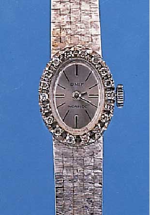 ONIF DAMENGOLDBANDUHR, SCHWEIZ UM 1962, NEU-TR. WG 750/000-GEH. INCL. WG-GLIEDERBAND RODH.AUFWEND. OVALE LüNETTE M. 18 8/8 DIAMANTEN ZUS. CA. ...