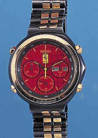 FERRARI ARMBANDCHRONOGRAPH, REF.-NR. 110834,UM 1995, EDELST., ASYM. FORM, SCHW. VERCHR., ASYM. BAND, LüNETTE WIE DRüCKER U. ZWISCHENGL.DES BANDES ...