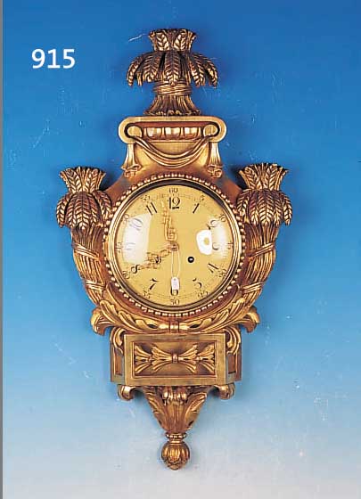 GROßE KARTELLUHR, SCHWEDEN, UM 1950/60, GESCHNITZTES UND VERGOLDETES HOLZGEHäUSE MIT ÄHRENMOTIVEN, SCHWUNGBEREICH DES PENDELS VER- GLAST, ...