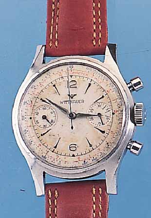 WITTNAUER ARMBANDCHRONOGRAPH, REF.-NR. 3256, SCHWEIZ UM 1966, EDELST., BODEN GESCHR.,VERS. ORIG.-BLATT FL., 30-MIN.-STOPPZäHLER, TELE- U. ...