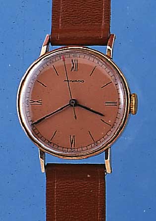 MOVADO HERRENARMBANDUHR, REF.-NR. 62742, SCHWEIZ UM 1940, METALL M. 20 MICRON ROSE-G.- AUFL., BODEN U. GLASR. GEDR., KUPFERFARB. ORIG.-BLATT, ...