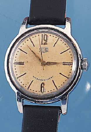 GUB HERRENARMBANDUHR, DEUTSCHLAND UM 1957, METALL VERCHR., BER., EDELST.-SCHR.-BODEN, KAL. 60,1, INDIR. ZENTRALSEK., VERS. BLATT FL., ...