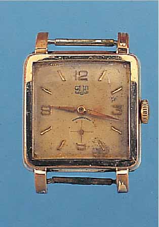 GUB HERRENARMBANDUHR, DEUTSCHLAND UM 1955, METALL VERG. BER., EDELST.-BODEN GEDR., VERS. BLATT FL., FORMANKERW., BAUWEISE RAUMNUTZWERK,15 ST., KAL. ...