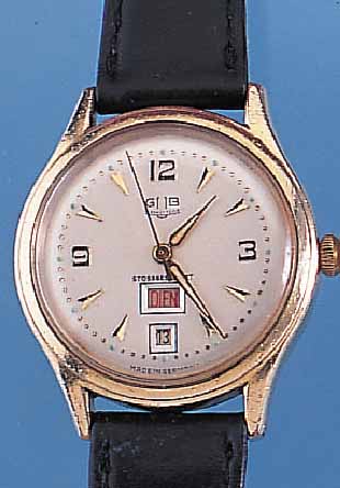 GUB HERRENARMBANDUHR, REF.-NR. 50247, DEUTSCHLAND UM 1959, METALL M. GG-AUFLAGE, EDELST.-BODEN GEDR., SELTENE TAG U. DATUM- ANZ. DURCH ...