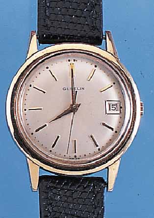 GUEBELIN HERRENARMBANDUHR, REF.-NR. 4283333,SCHWEIZ UM 1960, EDELST., BODEN GESCHR., MAS- SIVE GG-LÜNETTE, STARKE GG-SCHULTERN, VERS. BLATT, ...