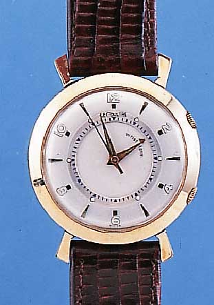 LE COULTRE ARMBANDWECKER WRISTALARM, REF.- NR. 3015, SCHWEIZ/USA UM 1952, GG-FILLED, GLASR. GEDR., BLATT REST., 17 ST., KAL. 814, GEH- U. ...
