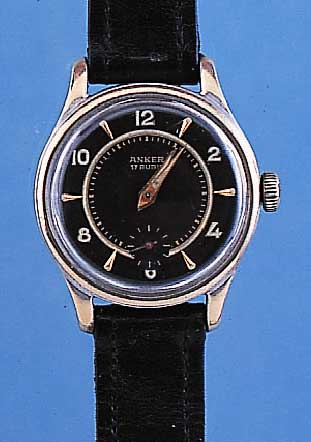 UNIVERSAL HERRENARMBANDUHR MODELL ANKER, REF.-NR. 31230, SCHWEIZ UM 1950, METALL VER- CHR./BER., EDELST.-SCHR.-BODEN M. SELTENER UNIVERSAL ...
