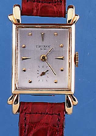 TOURNEAU WATCH CO. HERRENARMBANDUHR, SCHWEIZ/USA UM 1945, GG 585/000, AUFWEND. RECT.-FORM M. BET. BANDANST., MINERALKONKAVGL.M. L. ...
