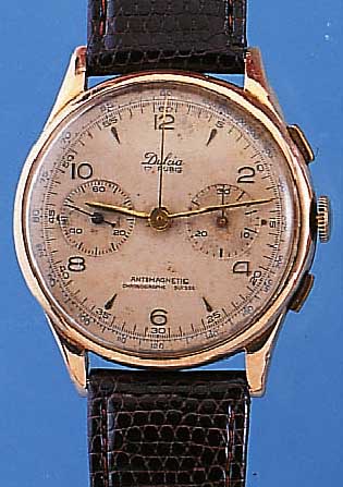 DULCIA ARMBANDCHRONOGRAPH, REF.-NR. 2654, SCHWEIZ UM 1949, RG 750/000, BODEN U. GLASR. GEDR., METALLCUV. ZUR ARMIERUNG, 30-MIN.- ...