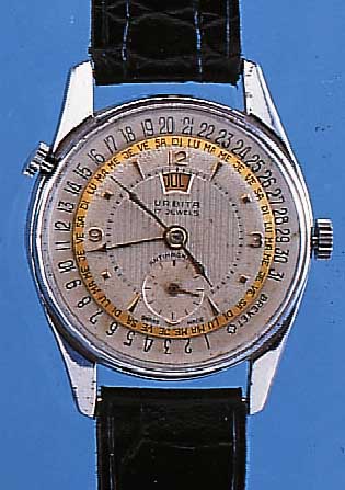 URBITA HERRENARMBANDUHR, REF.-NR. 914, SCHWEIZ UM 1950, METALL VERCHR., EDELST.-BODENGESCHR., SELTENE VOLLKALENDERANZ. AUßER MOND- PHASE, ...