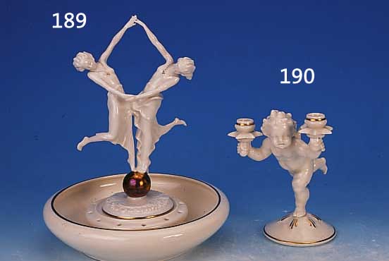 KERZENLEUCHTER, HUTSCHENREUTHER, ABT. FüR KUNST, 2. WAHL, PUTTO, ZWEI BRENNSTELLEN, SPARSAM VERGOLDET, H. CA. 17 CM