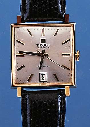TISSOT HERRENARMBANDUHR STYLIST, SCHWEIZ UM 1964, GG 585/000, CARREE-GEH., MAßE üBER DIE FLäCHEN CA. 29 X 29 MM, VERS. BLATT ALTERSBE- D. L. ...